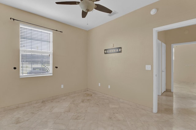 unfurnished room with ceiling fan