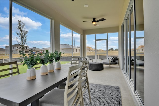 sunroom / solarium with ceiling fan