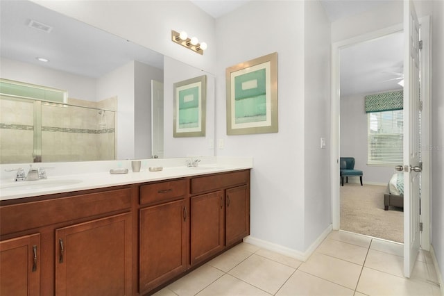 full bathroom with visible vents, a stall shower, a sink, tile patterned flooring, and double vanity