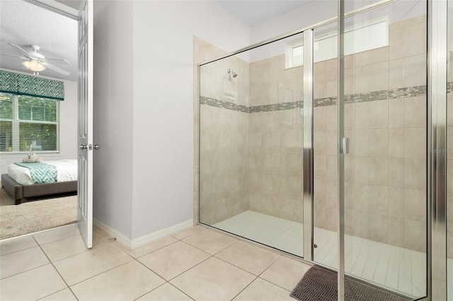 bathroom with a ceiling fan, baseboards, a stall shower, ensuite bathroom, and tile patterned floors