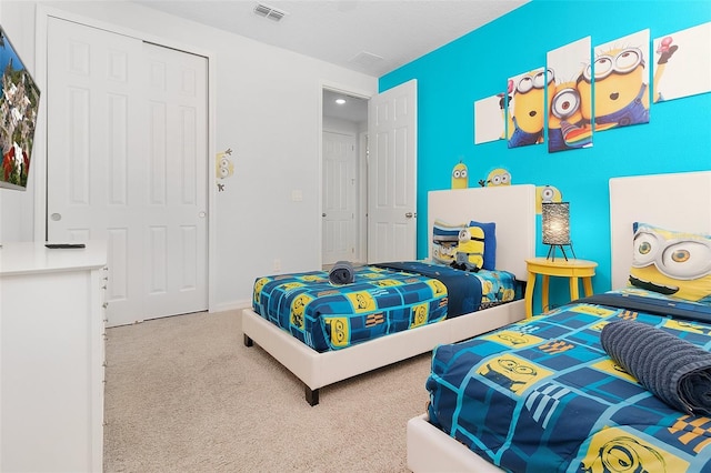 bedroom featuring visible vents and carpet flooring