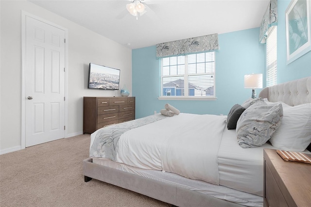 carpeted bedroom featuring ceiling fan