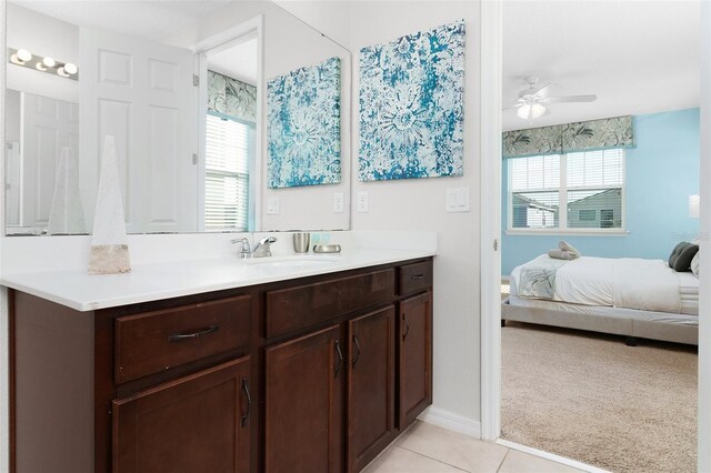 bathroom featuring tile patterned flooring, plenty of natural light, ceiling fan, and vanity