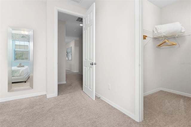 interior space featuring baseboards and carpet