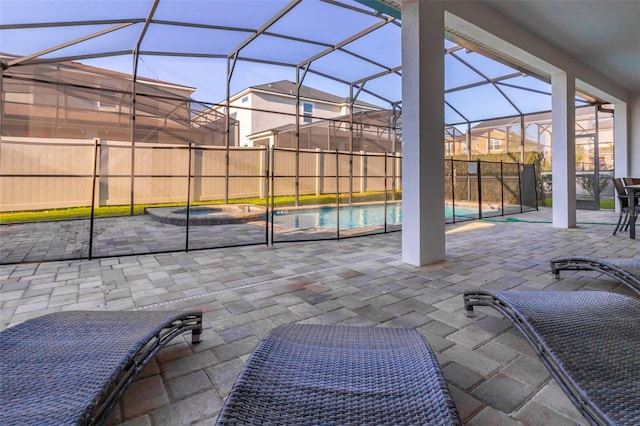 view of patio with a lanai and a fenced in pool