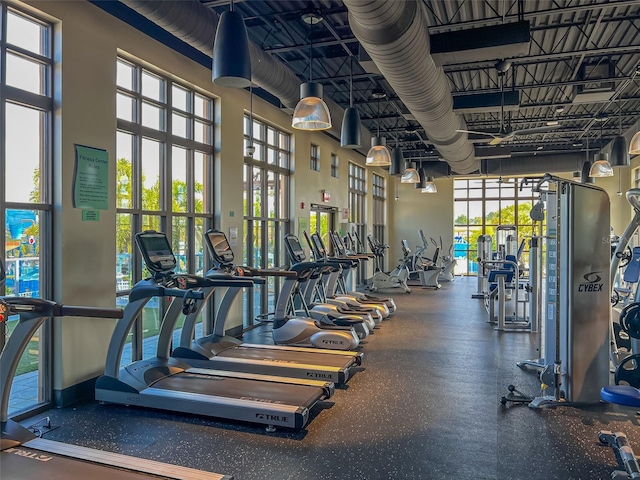 gym with a towering ceiling