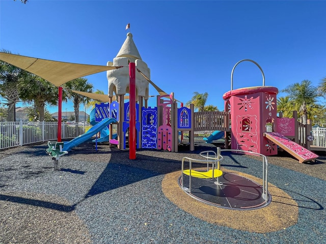 communal playground featuring fence