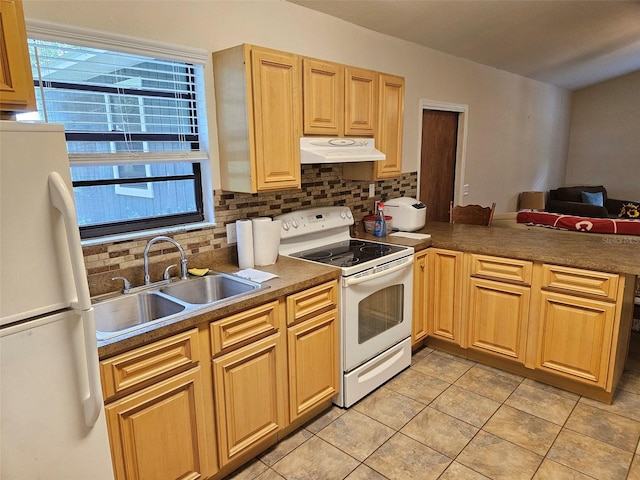 kitchen with a wealth of natural light, sink, tasteful backsplash, and white appliances