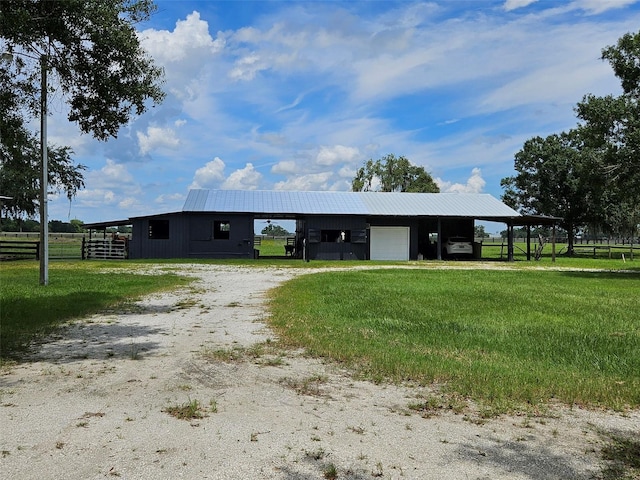 view of front of house with an outdoor structure