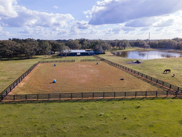 birds eye view of property featuring a rural view and a water view