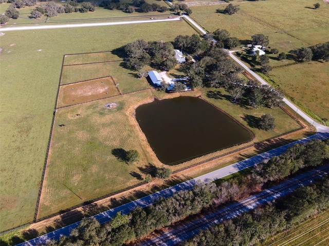 birds eye view of property with a rural view