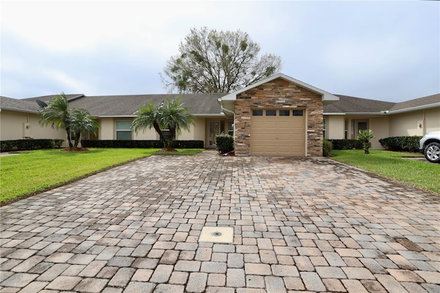 ranch-style home featuring a front lawn, stucco siding, decorative driveway, a garage, and stone siding