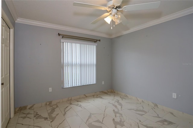 unfurnished room featuring a ceiling fan, marble finish floor, and crown molding