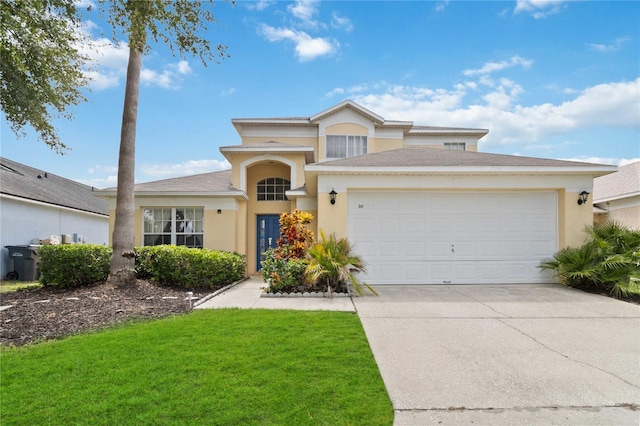 view of front property featuring a front yard and a garage