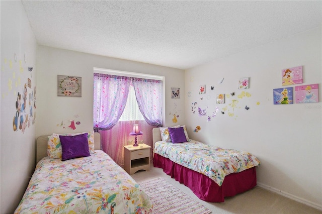 carpeted bedroom with a textured ceiling