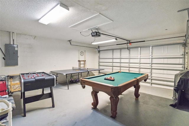 rec room featuring concrete floors, electric panel, a textured ceiling, and billiards