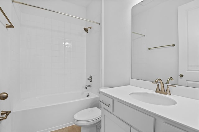 full bathroom featuring toilet, vanity, and tiled shower / bath combo