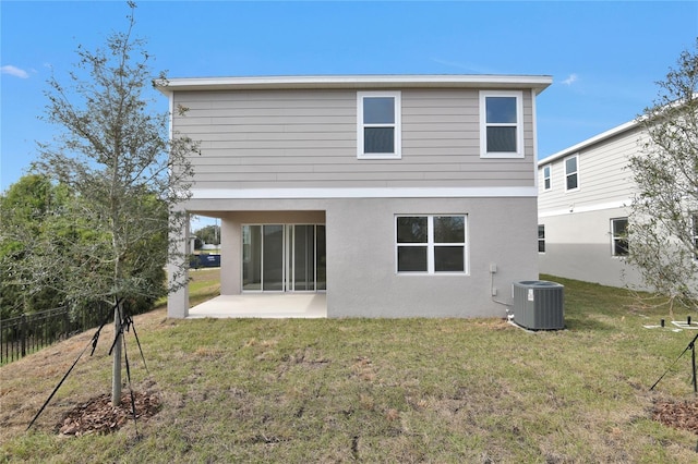 back of property featuring a patio, cooling unit, and a lawn