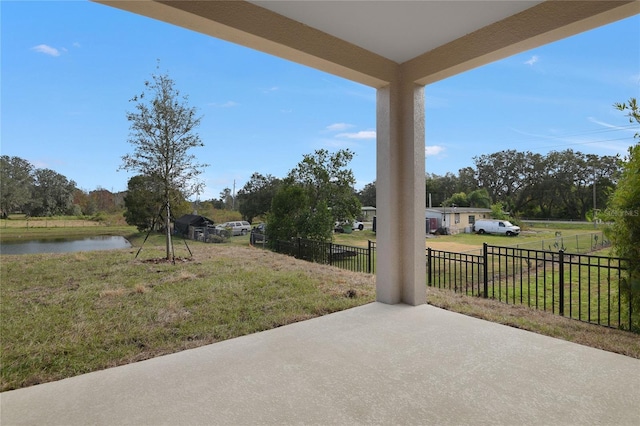 view of patio with a water view