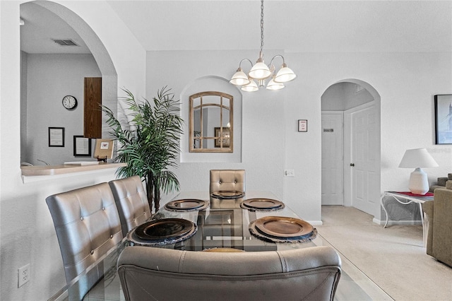 dining area with a notable chandelier