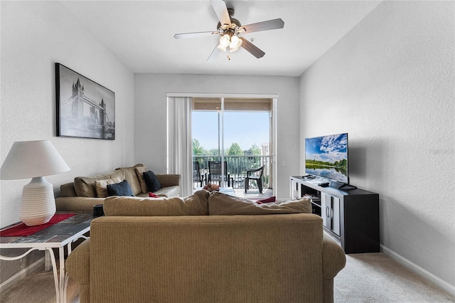 living room featuring ceiling fan and carpet floors