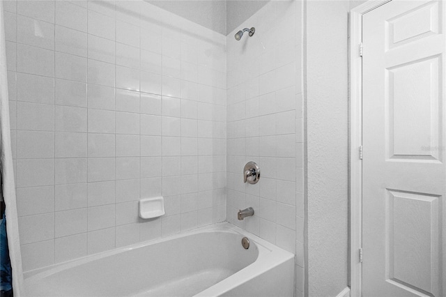 bathroom featuring shower / bathtub combination with curtain