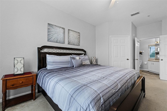 carpeted bedroom featuring ceiling fan and connected bathroom