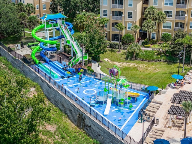 view of pool featuring a patio, a playground, and a lawn