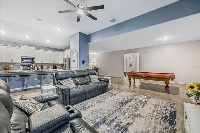 living room featuring light wood-type flooring, billiards, high vaulted ceiling, and ceiling fan