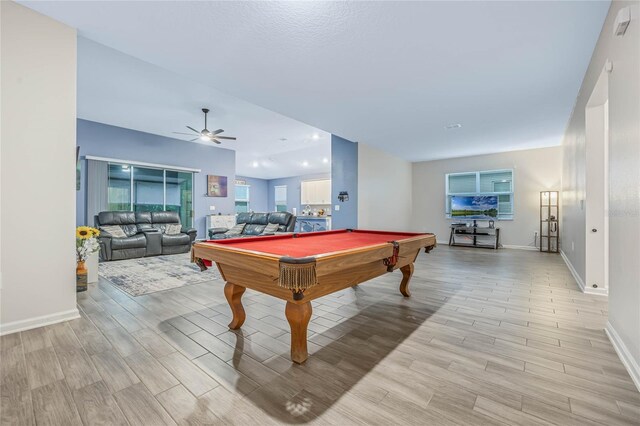 game room featuring billiards, baseboards, light wood finished floors, and ceiling fan