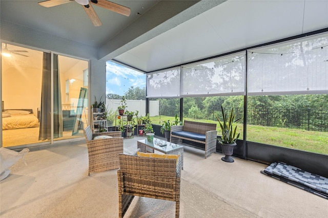 sunroom featuring a healthy amount of sunlight and ceiling fan