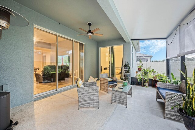 sunroom with a wealth of natural light and ceiling fan