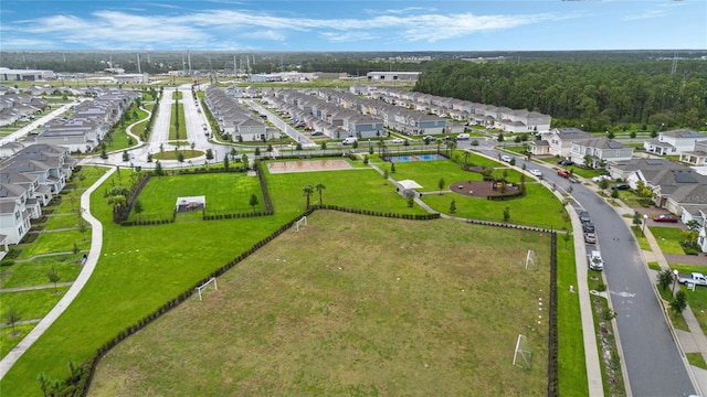 birds eye view of property with a residential view