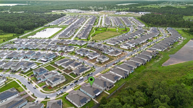 birds eye view of property featuring a residential view and a water view