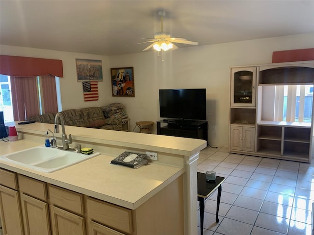 kitchen featuring sink, light brown cabinets, light tile patterned flooring, and ceiling fan