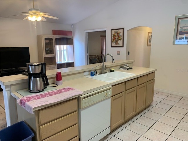 kitchen featuring dishwasher, sink, an island with sink, lofted ceiling, and light tile patterned floors