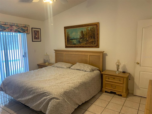 bedroom with ceiling fan, vaulted ceiling, and light tile patterned floors