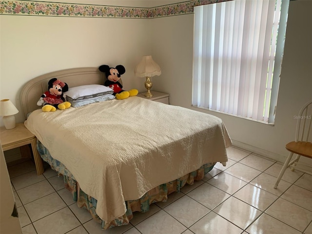 bedroom featuring light tile patterned flooring