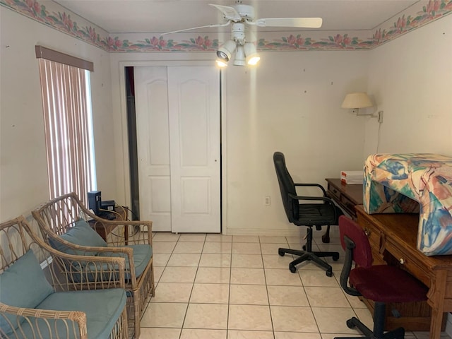 home office featuring ceiling fan and light tile patterned floors