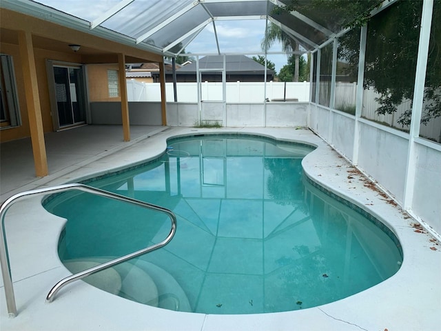 view of pool featuring a lanai and a patio