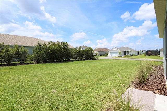 view of yard featuring a garage