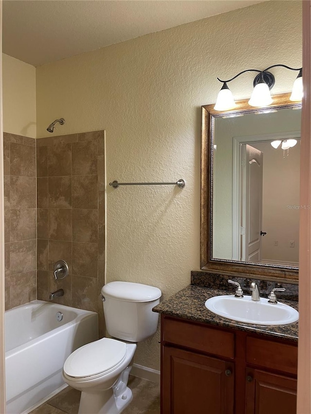 full bathroom featuring a textured wall, toilet, shower / bath combination, vanity, and tile patterned floors