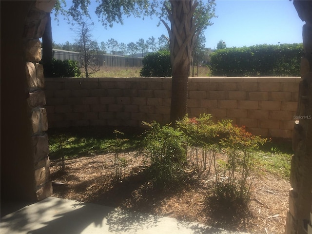 view of yard with fence