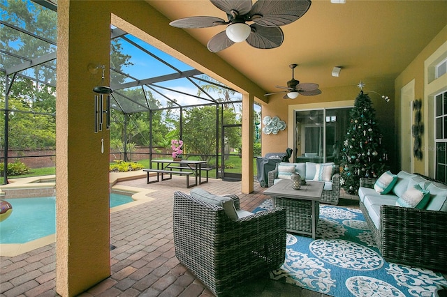 view of patio with a ceiling fan, glass enclosure, an outdoor pool, and an outdoor living space