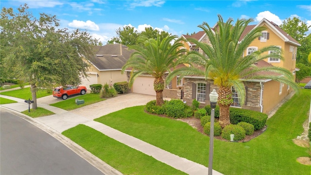 view of front facade featuring a front yard and a garage