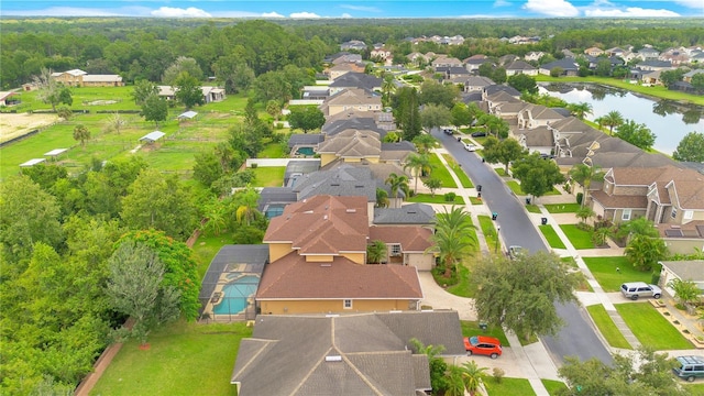 birds eye view of property with a residential view and a water view