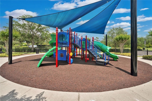 communal playground featuring fence