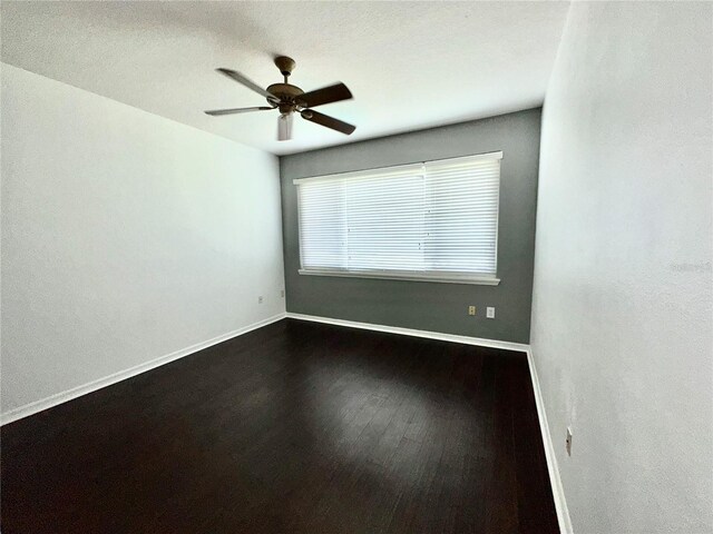 spare room featuring ceiling fan and wood-type flooring