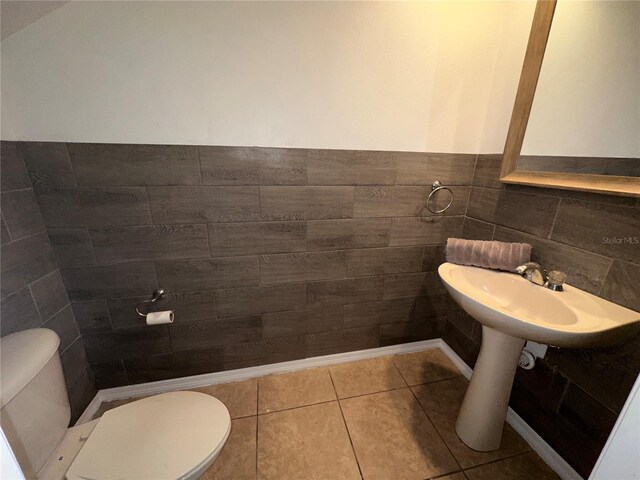 bathroom featuring tile patterned flooring and toilet