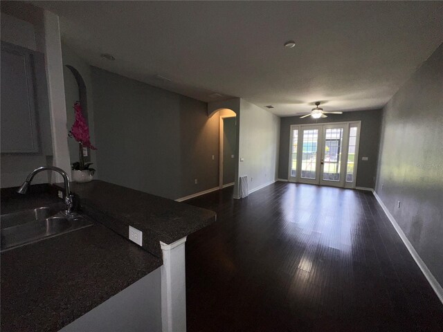 interior space featuring sink, ceiling fan, dark hardwood / wood-style flooring, and french doors